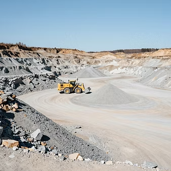 Aggregate pit with heavy machinery